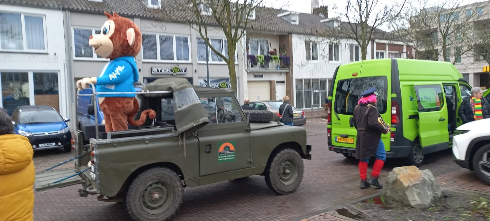 Land Rover Series 2 88 during a parade with a mascot in the back